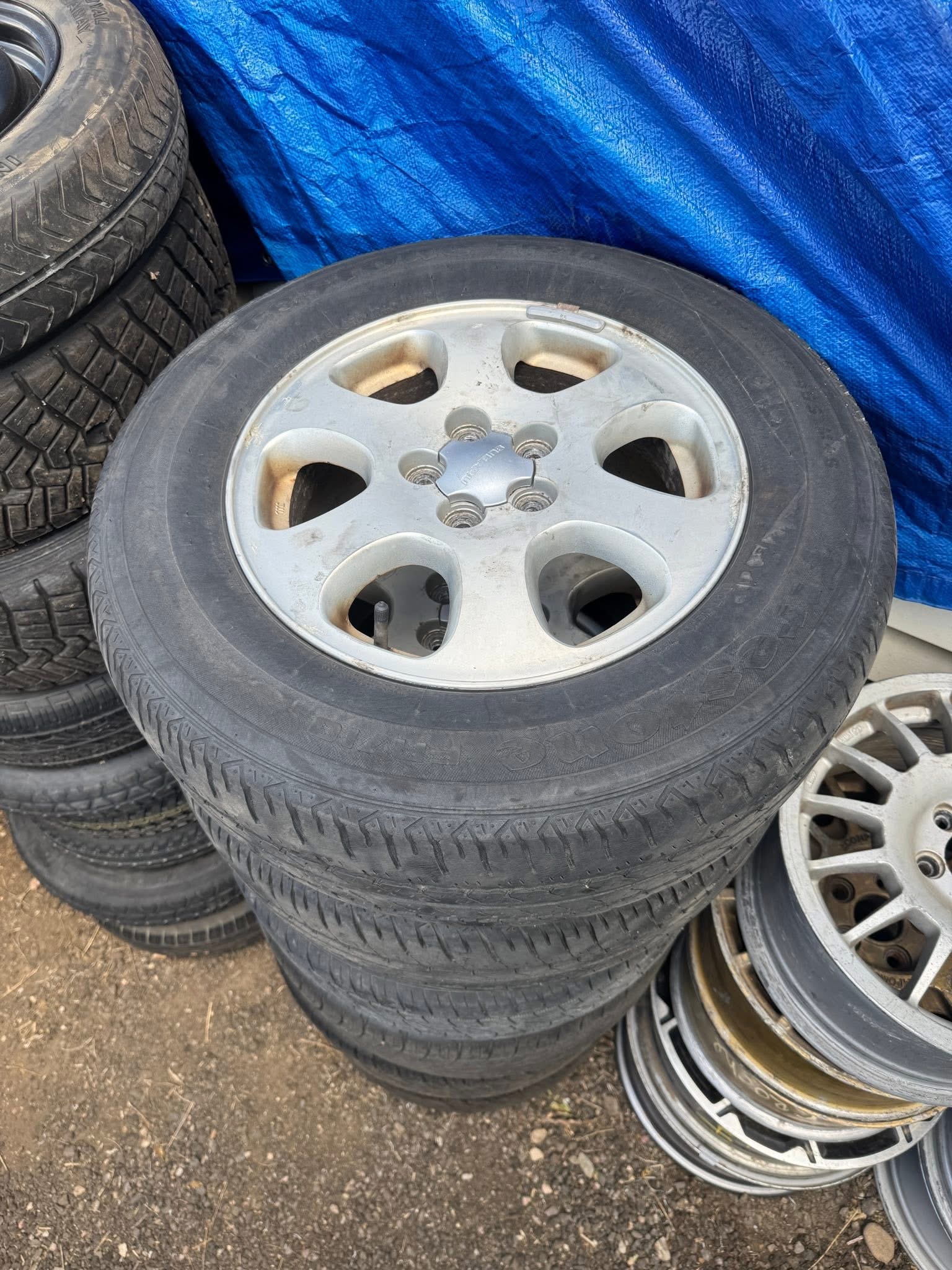 $100: 98 Outback Wheels, tires hold air but need replaced, good rollers 
